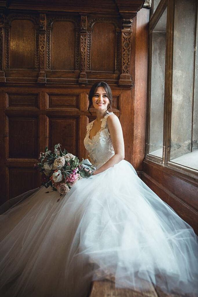 bridal_portrait_by_window_brown_timber_wall_kingswood_arts_dulwich_london_wedding_venue